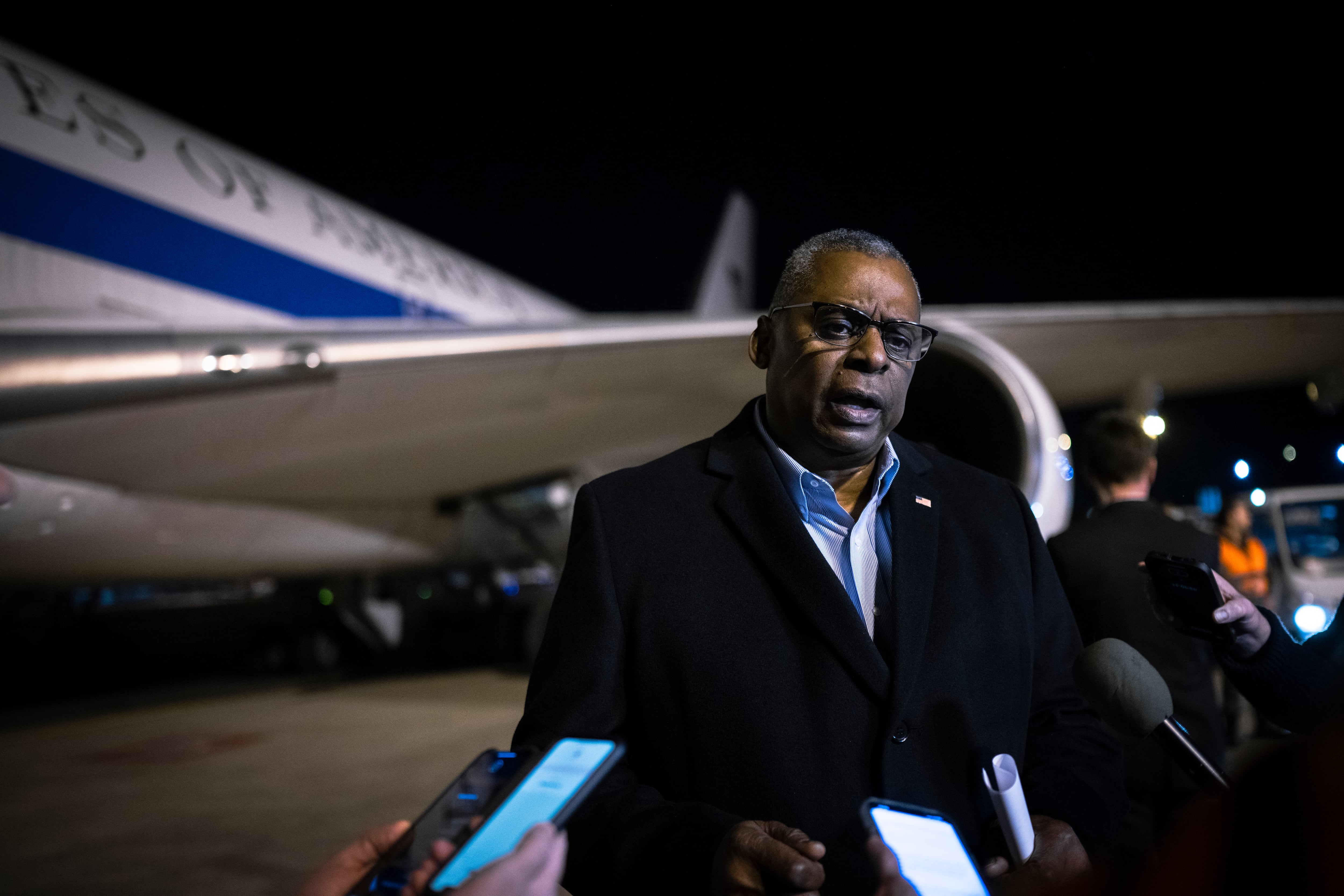 Secretary of Defense Lloyd J. Austin III addresses the traveling media upon arrival in Brussels, Belgium, Feb. 13, 2023.