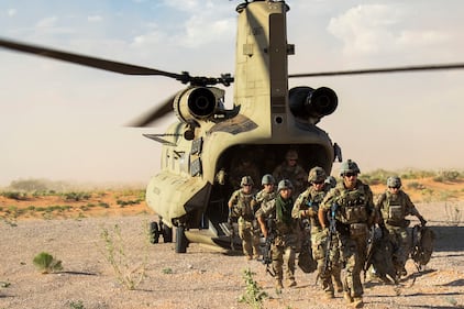 Soldiers assigned to 2nd Battalion, 106th Cavalry Squadron, Illinois National Guard, exit a CH-47 Chinook helicopter during a training exercise near McGregor Range Complex, N.M., July 13, 2020.