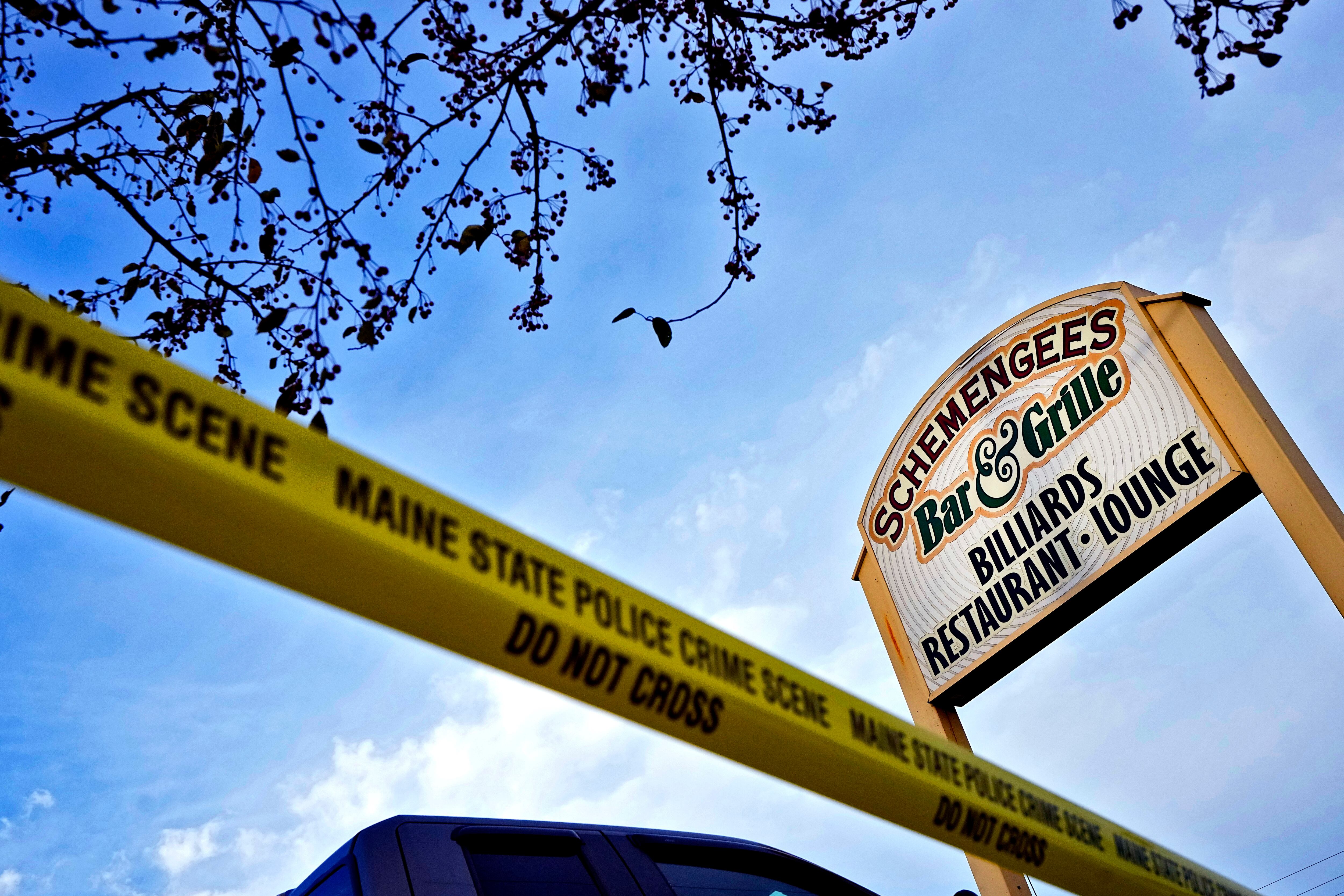 Crime scene tape surrounds Schemengees Bar & Grille, Oct. 29, 2023, in Lewiston, Maine, the scene of a mass shooting.