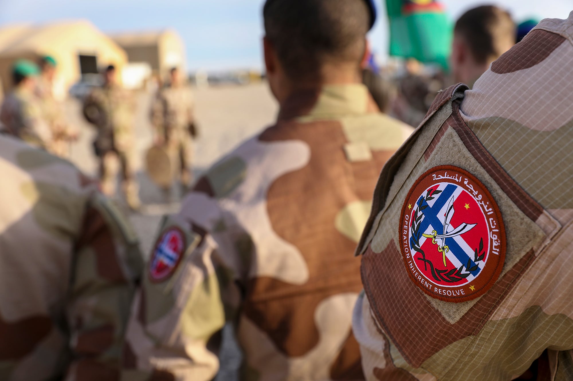 Norwegian soldiers of the outgoing Norwegian ROTO 5 Battalion conduct a transfer of authority ceremony with the incoming ROTO 6 Battalion at Al Asad Air Base, Iraq, Feb. 15, 2020.