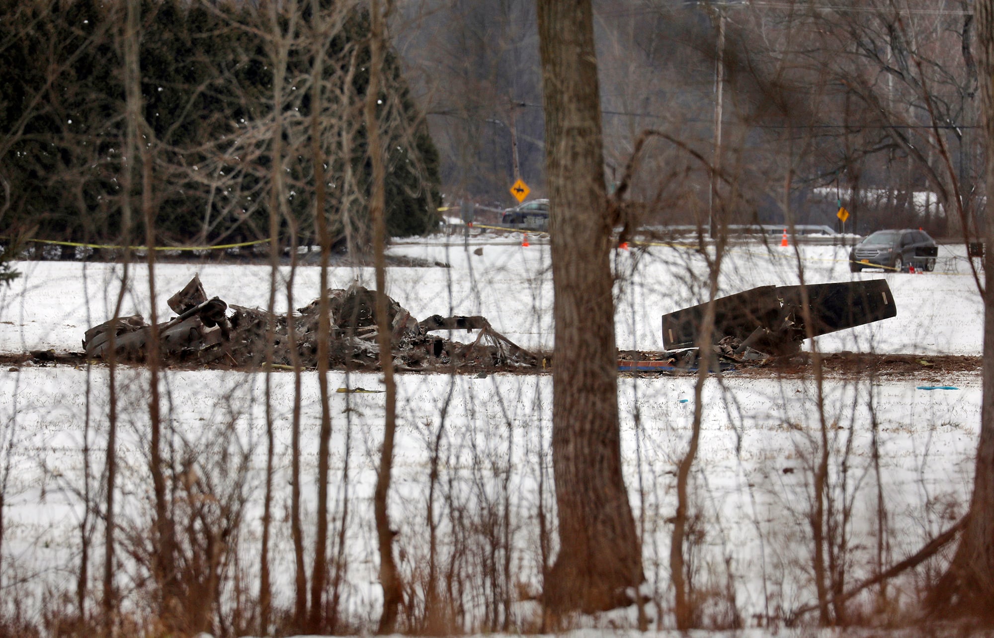 The wreckage of a UH-60 Black Hawk medical evacuation helicopter sits in a field in Mendon, NY., Thursday, Jan. 21, 2021.