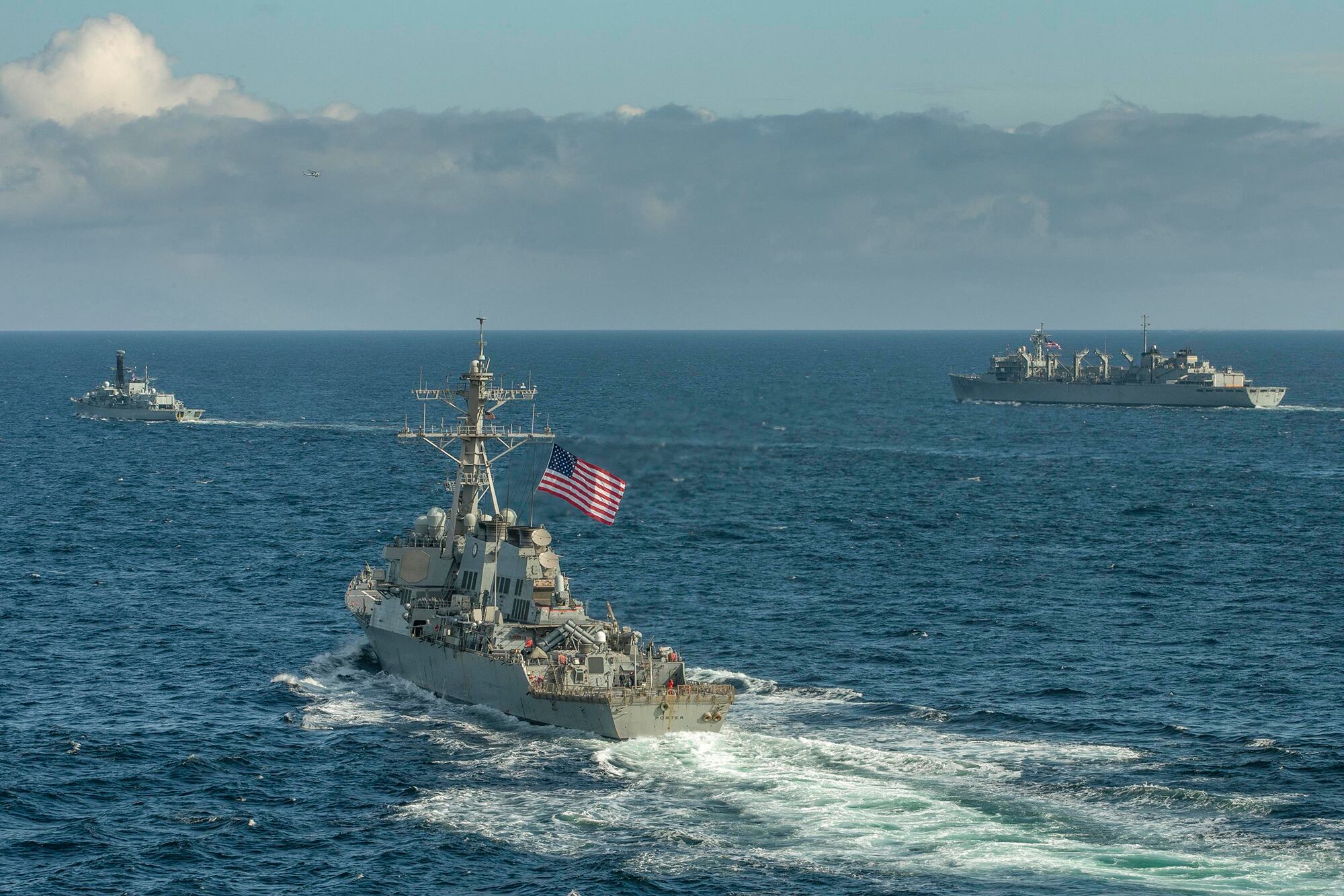 The Type-23 Duke-class frigate HMS Kent (F78), the Arleigh Burke-class guided-missile destroyer USS Roosevelt (DDG 80), the Arleigh Burke-class guided-missile destroyer USS Porter (DDG 78),  the Arleigh Burke-class guided-missile destroyer USS Donald Cook (DDG 75), and USNS Supply (T-AOE-6) conduct a photo exercise while conducting joint operations to ensure maritime security in the Arctic Ocean, May 5, 2020.