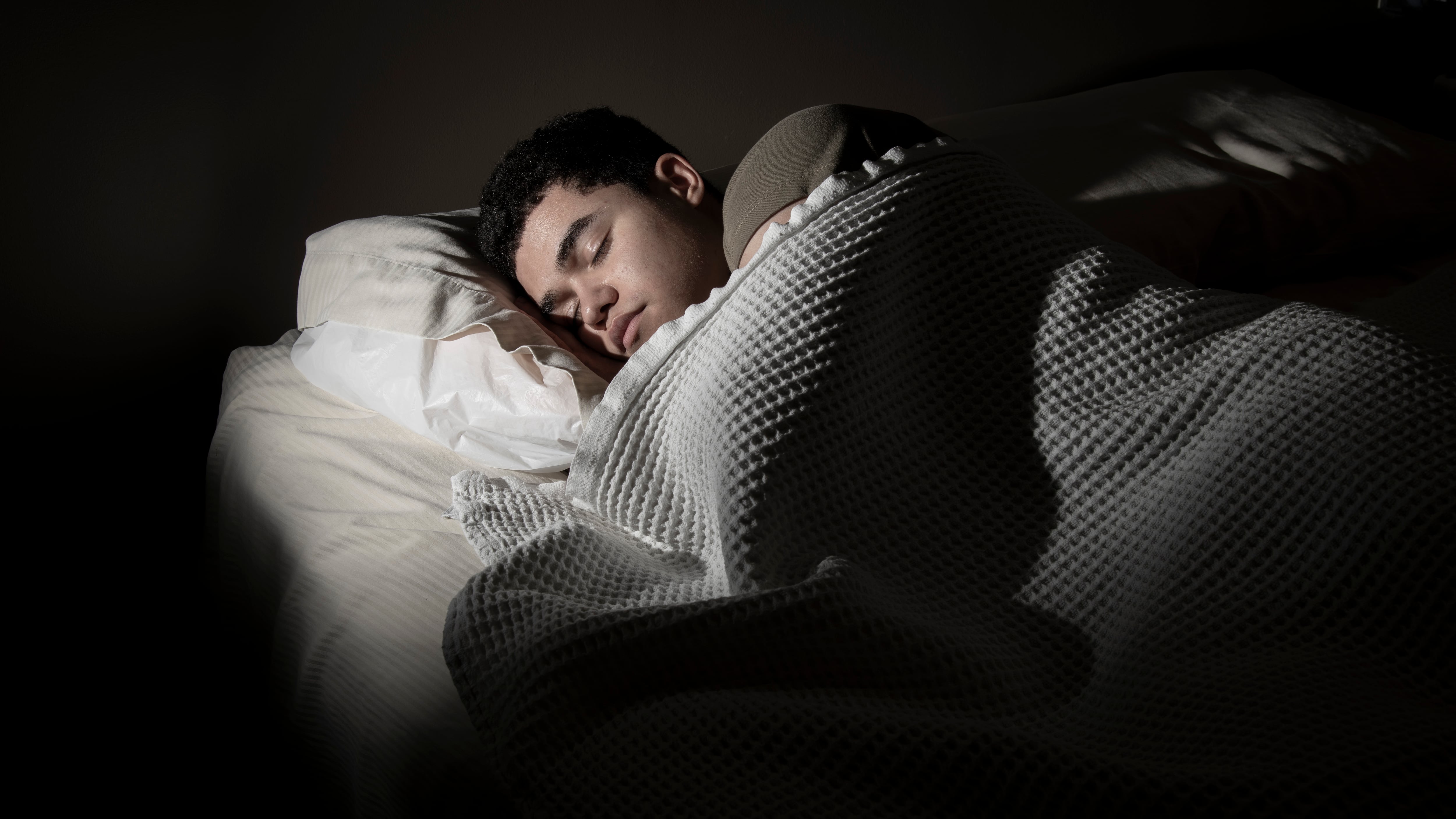 A service member sleeps after his duty day at Joint Base San Antonio – Lackland, Texas, March 24, 2023.