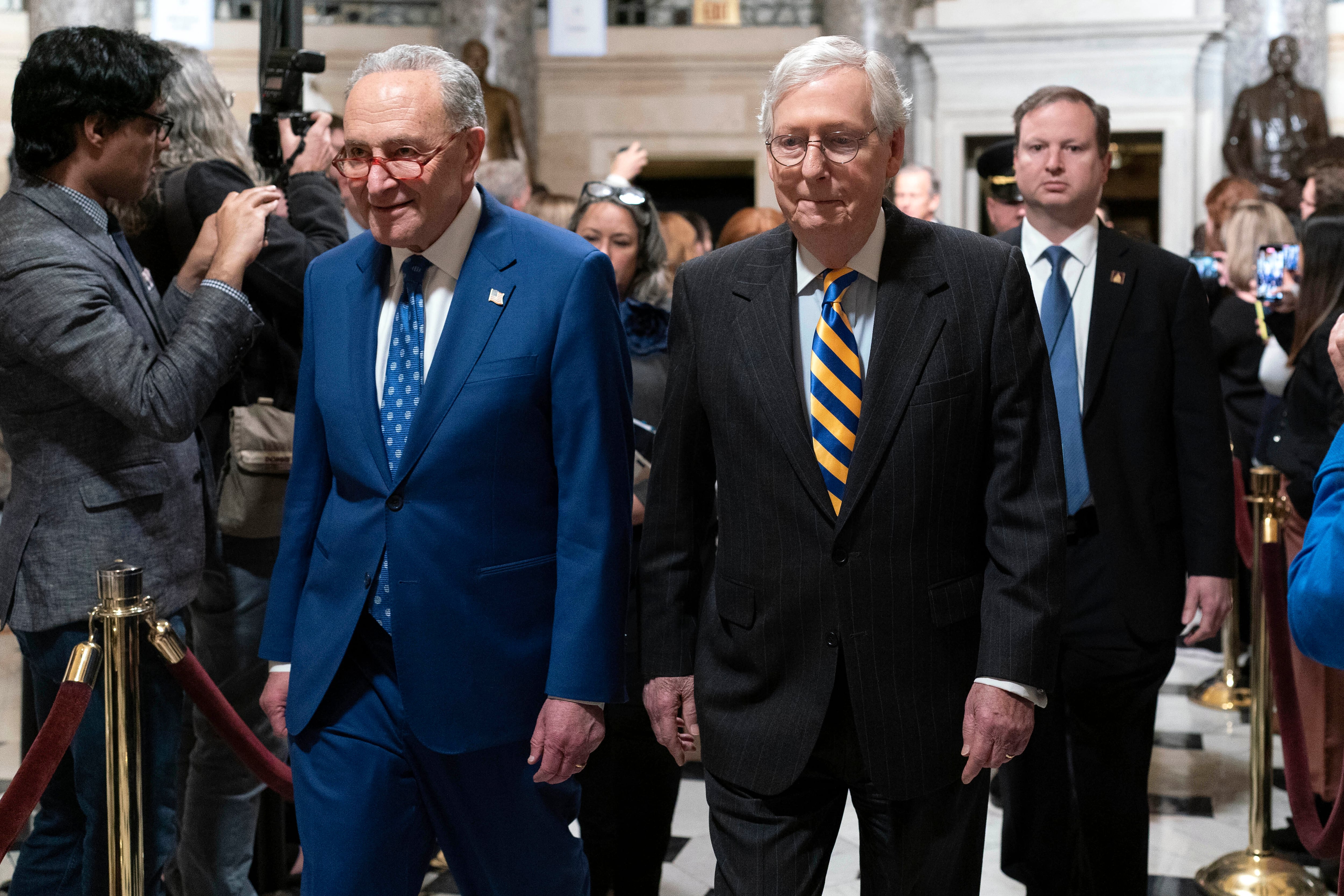 Senate Majority Leader Chuck Schumer, D-N.Y., left, accompanied by Senate Minority Leader Mitch McConnell, R-Ky., arrive for President Joe Biden's State of the Union address to a joint session of Congress at the Capitol, Tuesday, Feb. 7, 2023, in Washington.