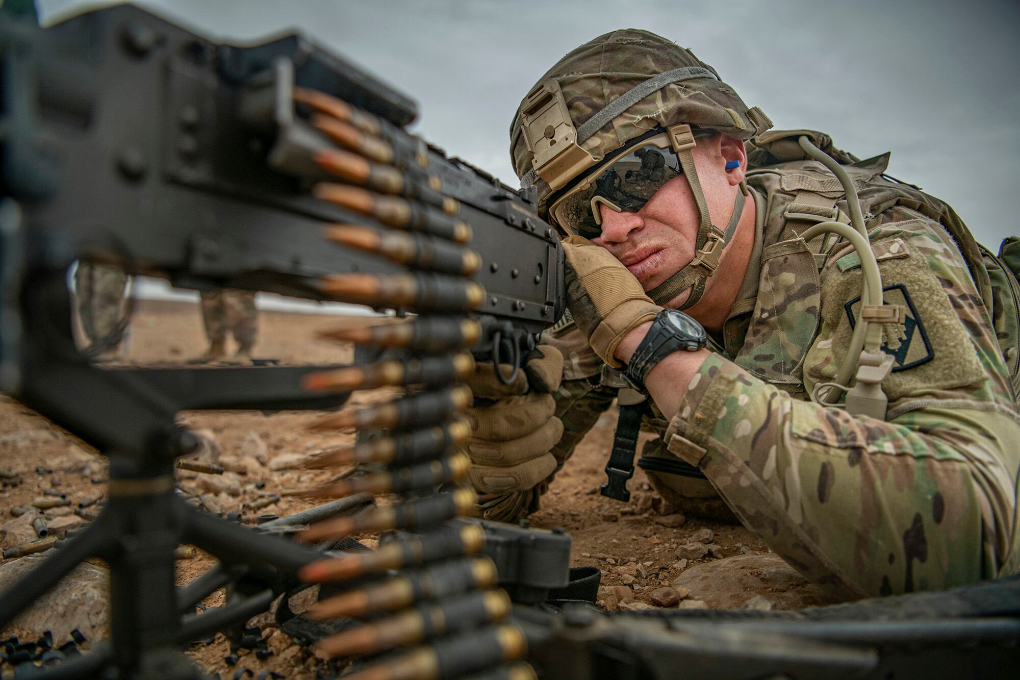 Staff Sgt. Dakota Montgomery fires an M240 machine gun during a weapon familiarization range on Nov. 28, 2020, while deployed to the Middle East in support of Operation Spartan Shield and Operation Inherent Resolve.