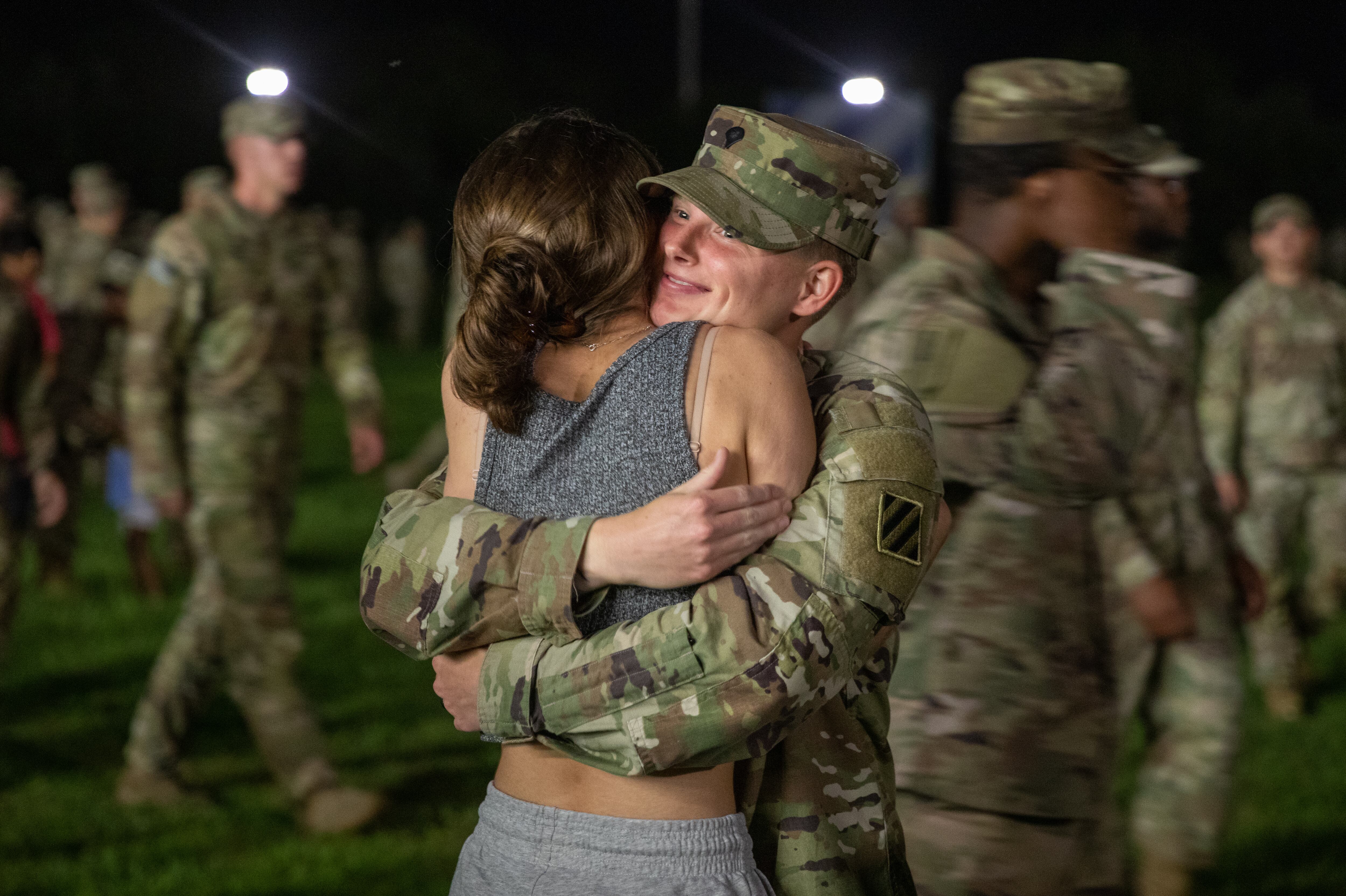 Spc. Jacqueline Richardson reunites with her family during one of several welcome home ceremonies at Fort Stewart, Georgia, Aug. 9, 2022.