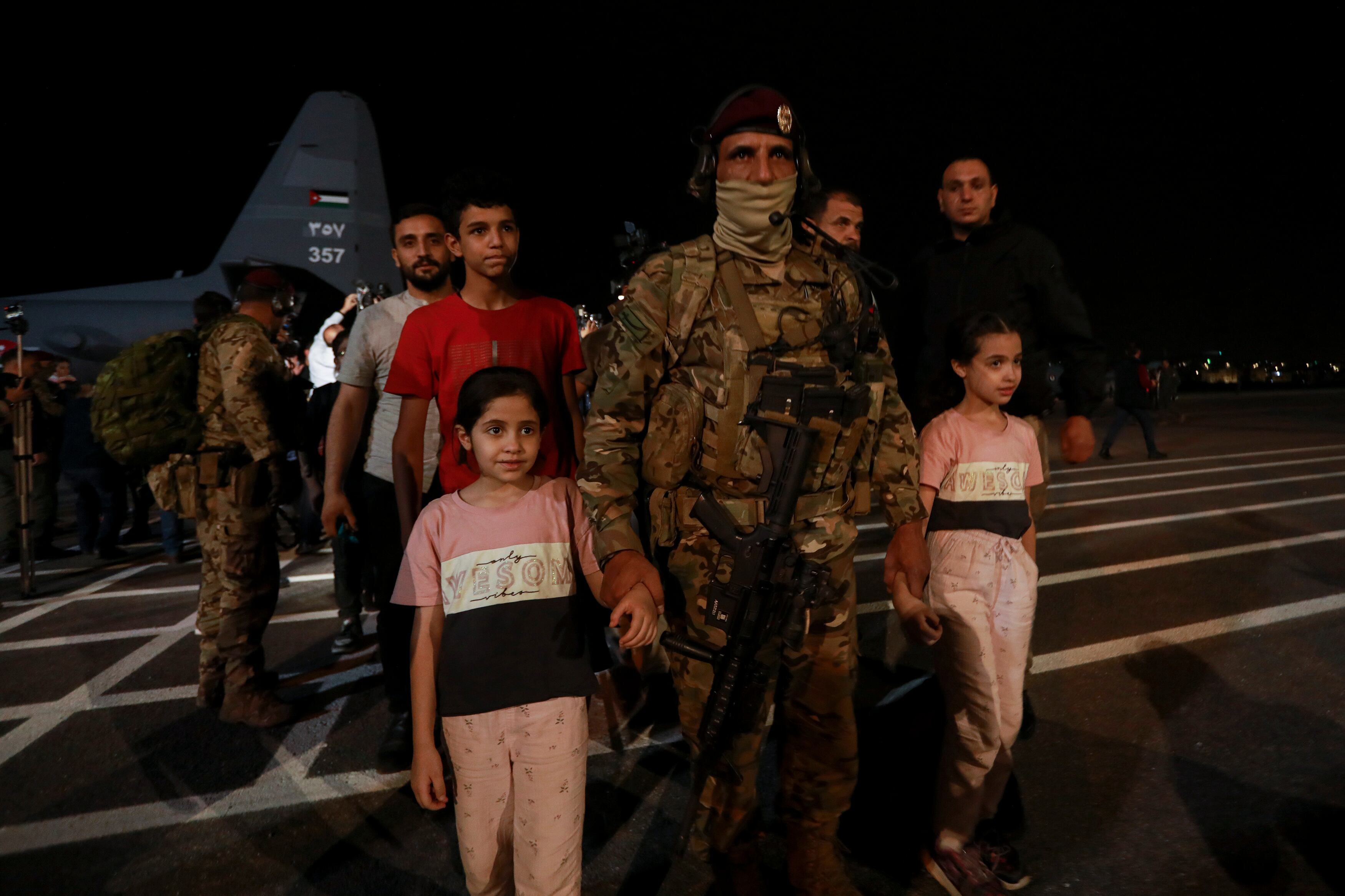 Jordanians evacuated from Sudan arrive at a military airport in Amman, Jordan, Monday, April 24, 2023.