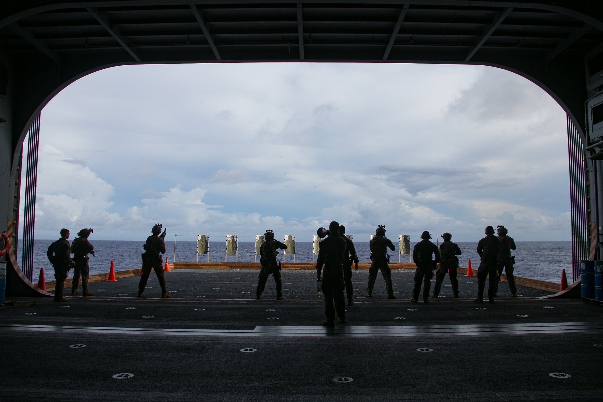 Marines with Force Reconnaissance Platoon, 31st Marine Expeditionary Unit (MEU), conduct a live fire exercise aboard the amphibious assault ship USS America (LHA 6) on Oct. 3, 2020, in the Philippine Sea.