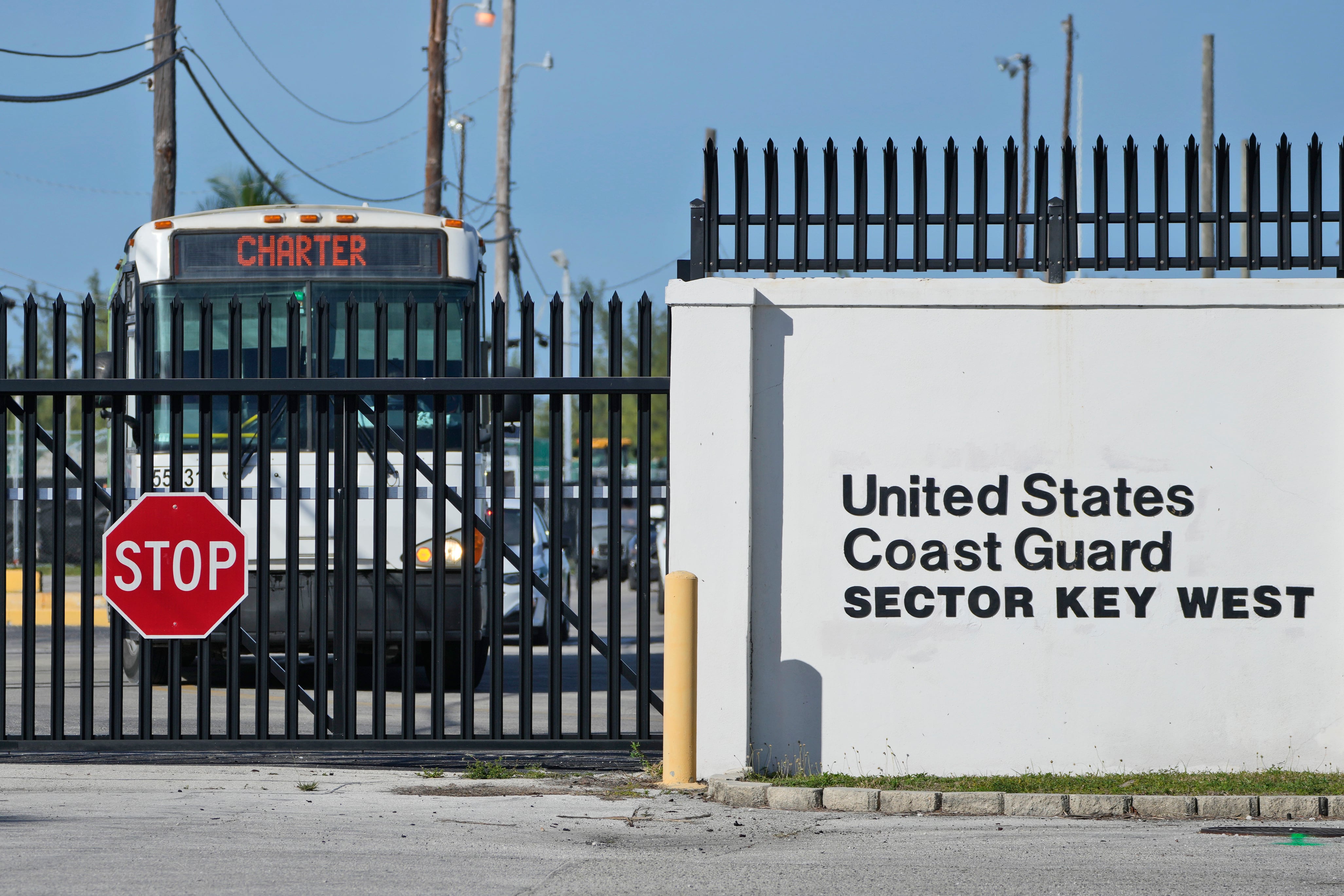 Buses carrying Cuban migrants leave from U.S. Coast Guard Sector Key West, Thursday, Jan. 5, 2023, in Key West, Fla.