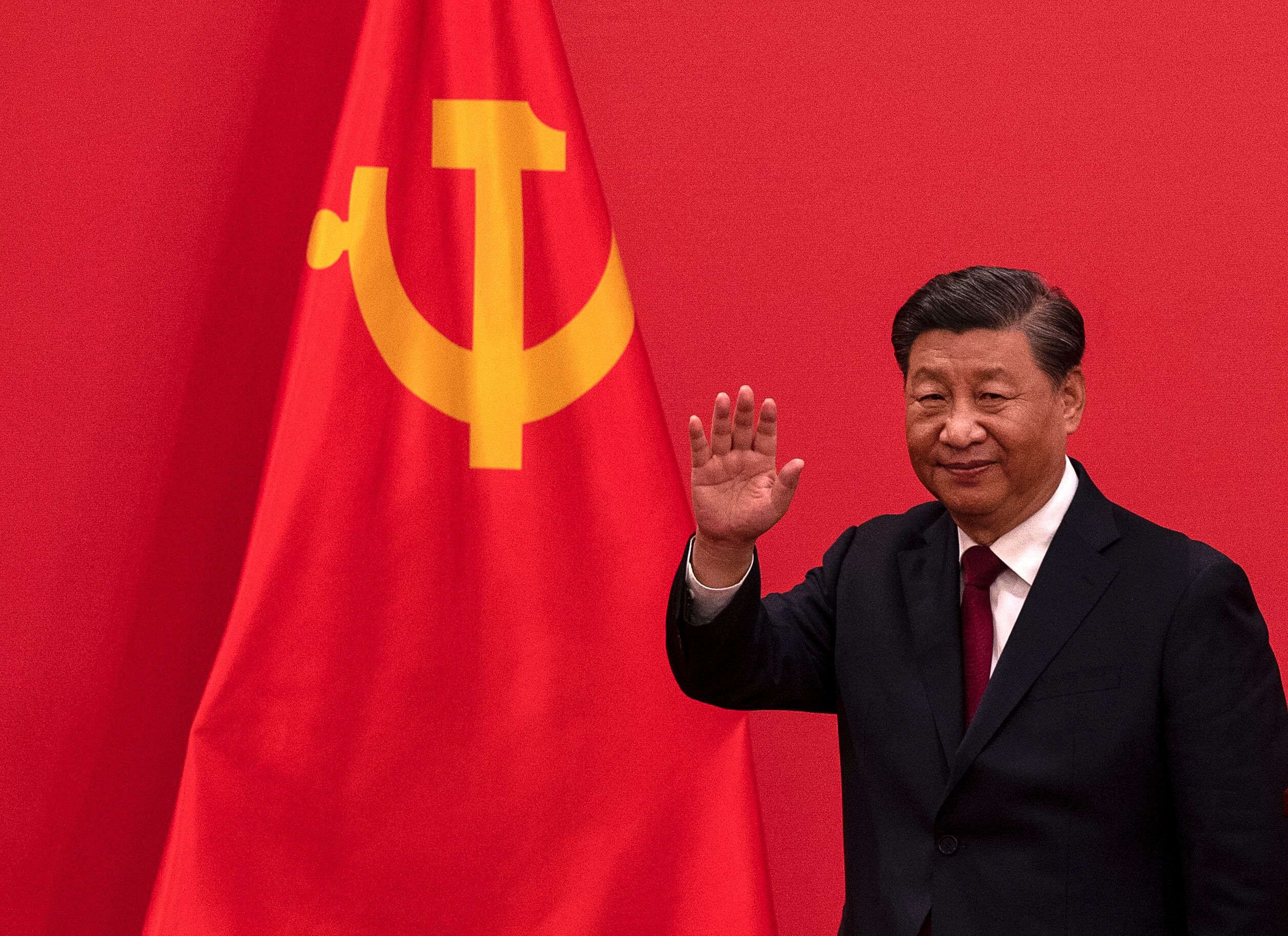 Chinese President Xi Jinping waves as he leaves after speaking at a press event at The Great Hall of People on Oct. 23, 2022, in Beijing, China.