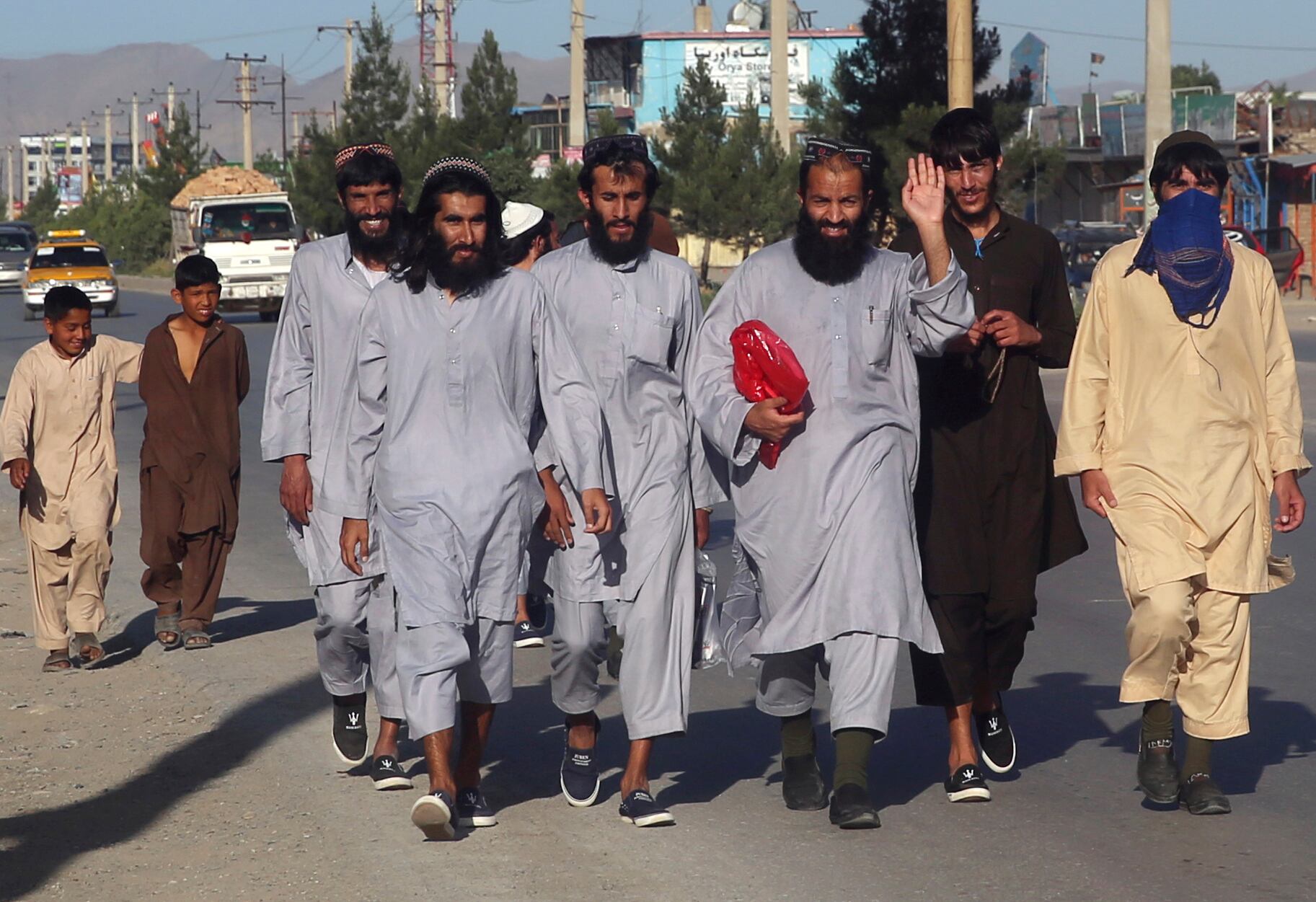 Afghan Taliban prisoners freed from Bagram Prison walk in Kabul, Afghanistan, Tuesday, May 26, 2020.