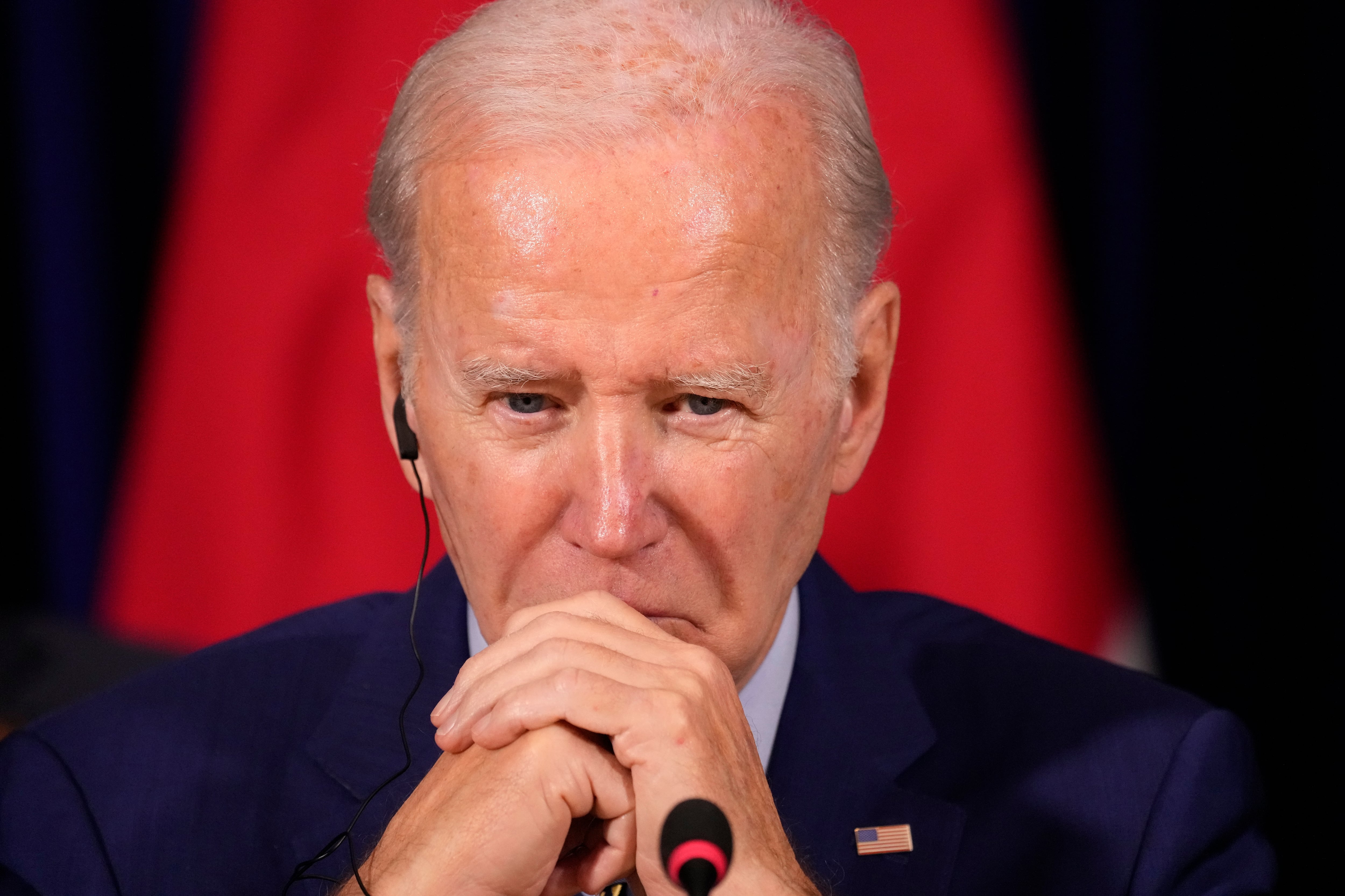 President Joe Biden listens during a meeting with South Korean President Yoon Suk Yeol and Japanese Prime Minister Fumio Kishida during the Association of Southeast Asian Nations (ASEAN) summit, Sunday, Nov. 13, 2022, in Phnom Penh, Cambodia.