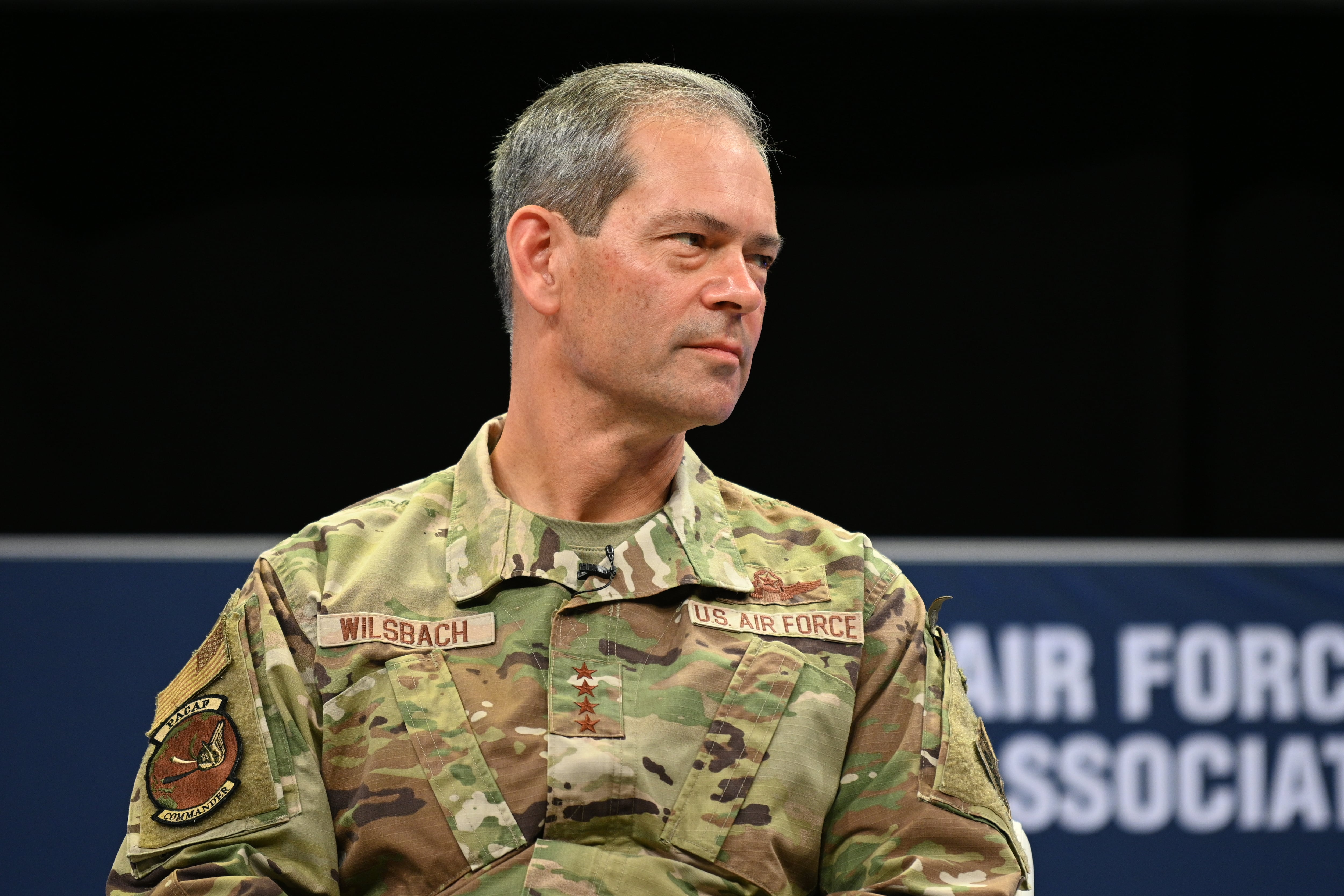 Air Force Gen. Kenneth Wilsbach, commander of Pacific Air Forces and Space Force Lt. Gen. B. Chance Saltzman, a deputy chief of space operations, speak onstage at the Air Force Association's Air Warfare Symposium in Orlando, Fla., March 3, 2022. (Mike Tsukamoto/AIr Force Magazine)