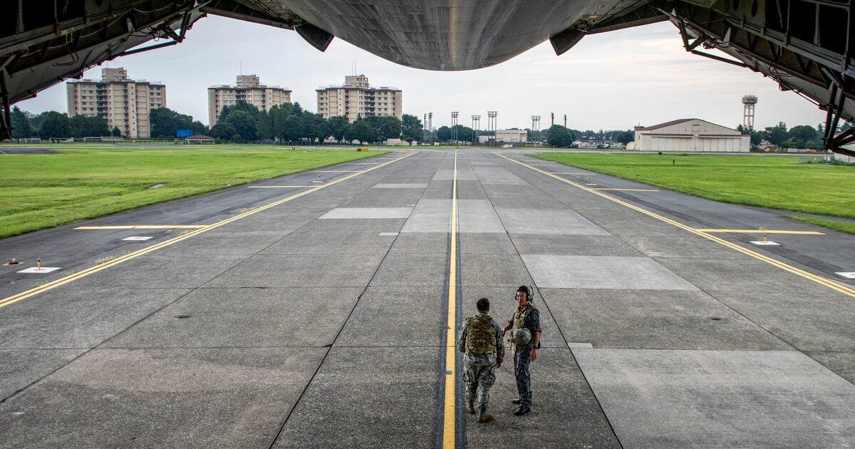 On the ground at Yokota Air Base, the Air Force transport hub of the 