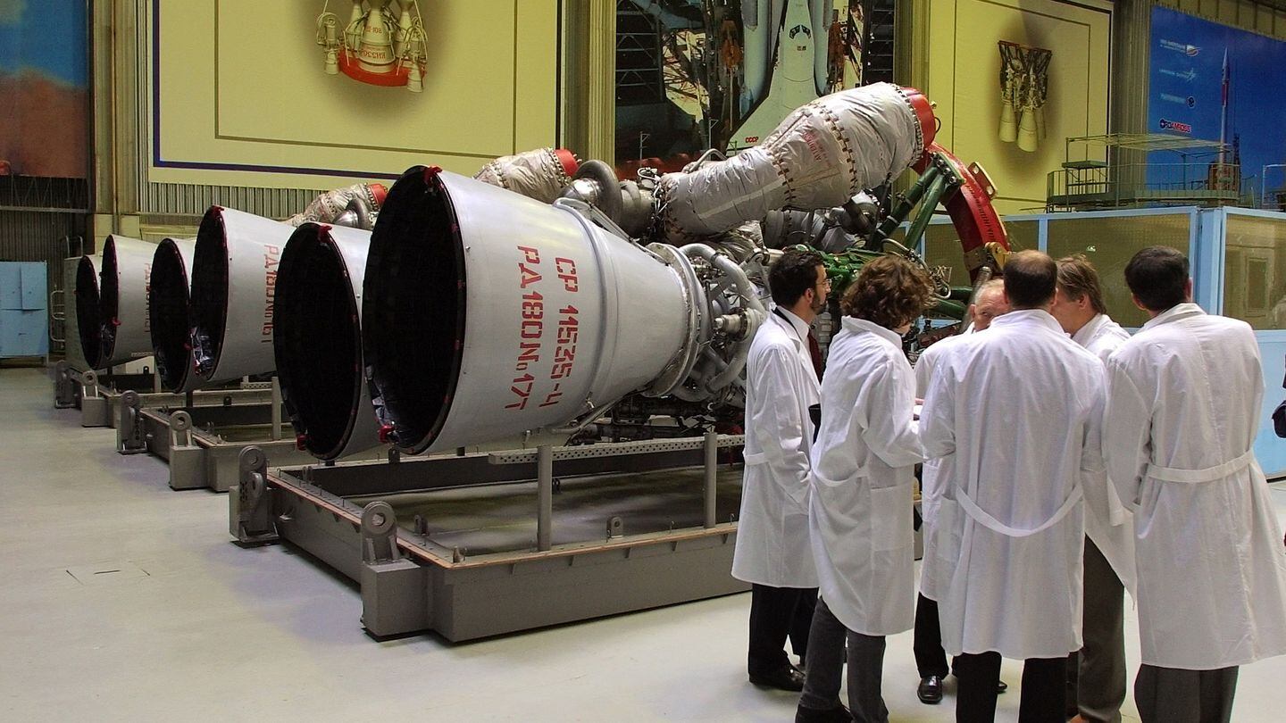 Energomash employees stand near RD-180 engines prepared for shipment to the United States from Russia in 2002. (Maxim Marmur/AP)